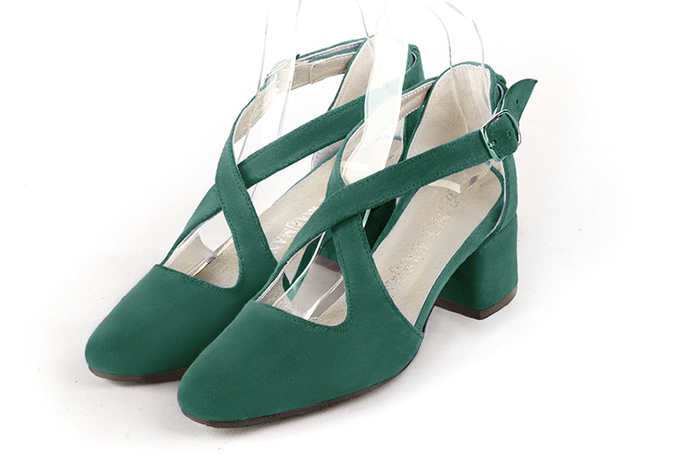 Women's emerald green elegant closed-back heels, with crossed straps. .  - Front view